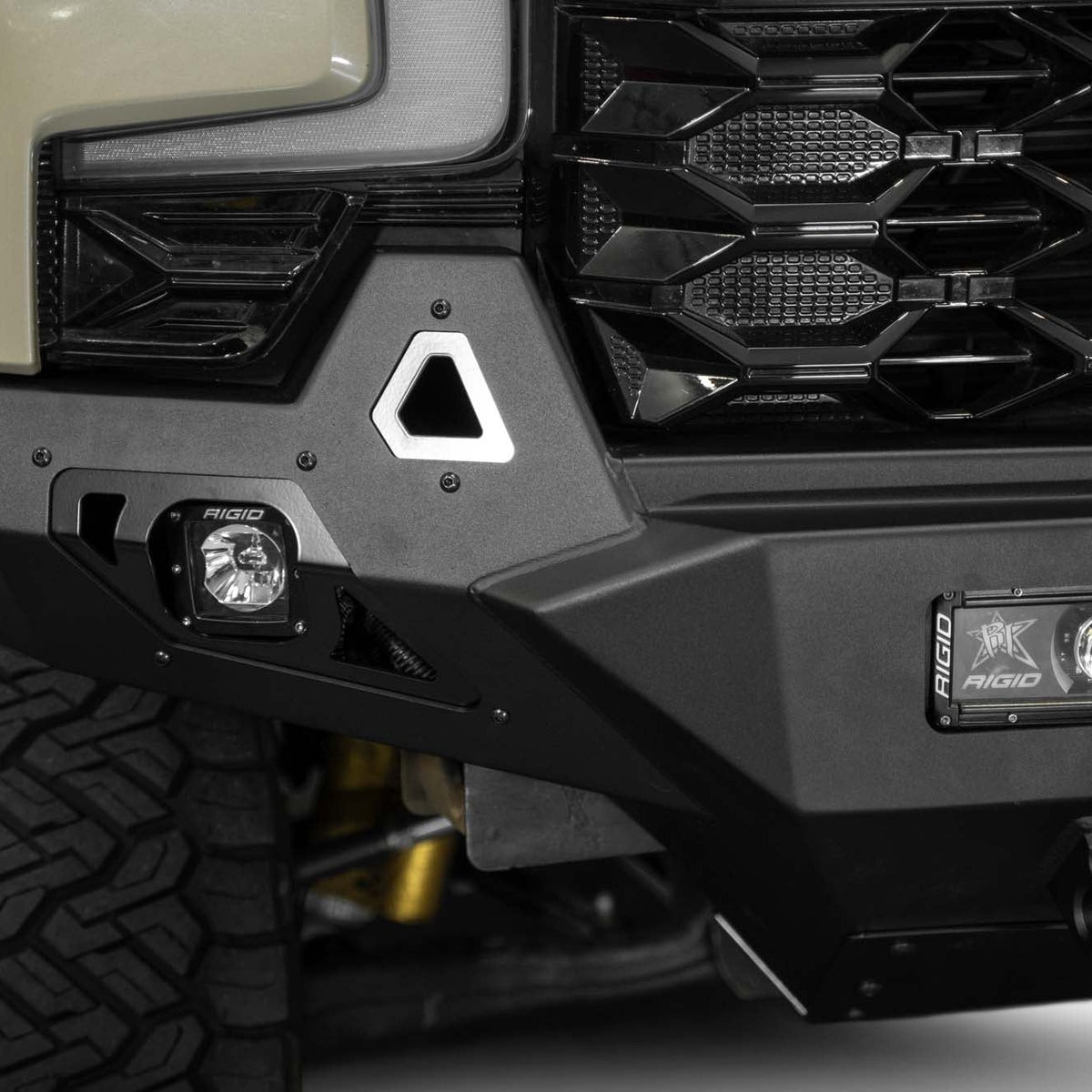 Close up view of 2022-2026 Chevy Silverado 1500 ZR2 Stealth Fighter Front Bumper with built-in tow hooks and off road lighting