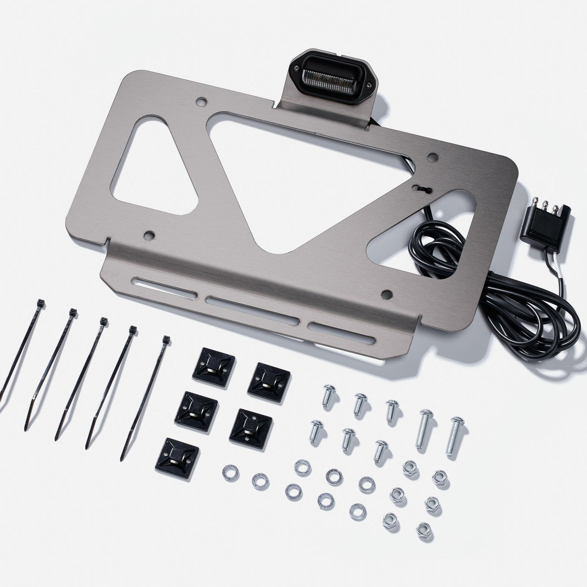 Ultraswing License Plate Light Kit with hardware laid out on a white background