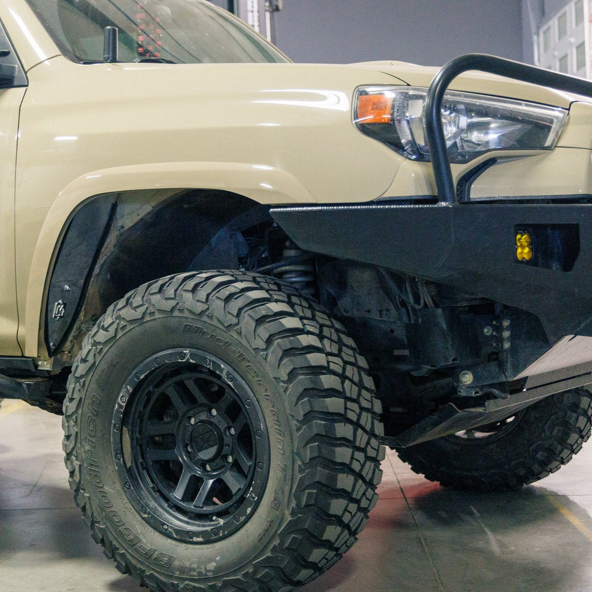 Quartering side view of a 5th Gen 4Runner with fender cuts and the C4 High Clearance Fender Liners kit.