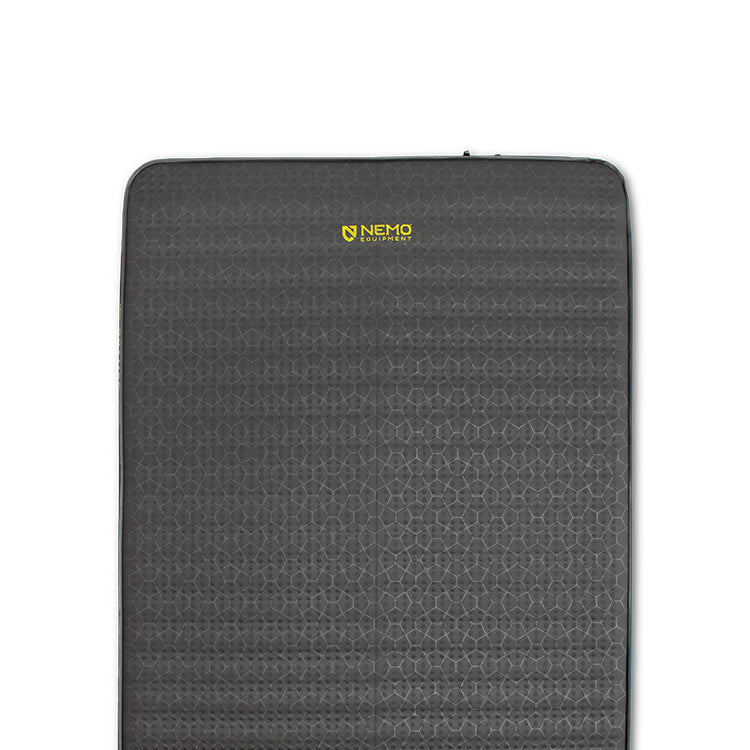 Rectangular, dark gray Roamer™ Self-Inflating Mattress by NEMO Equipment, featuring a textured surface and the yellow NEMO logo near the top center.