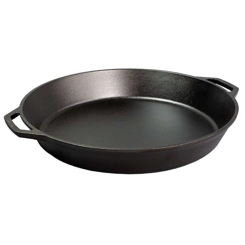 Black cast iron skillet with two loop handles.