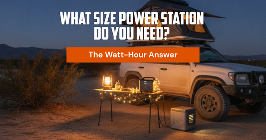 Blue-hour camp running on a portable power station — lantern, string lights and fridge powered, rooftop tent lit. TerrainVault sizing guide hero.