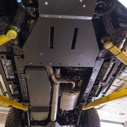 View from below showing the transmission/transfer case protection provided by the C4 skid plate kit.
