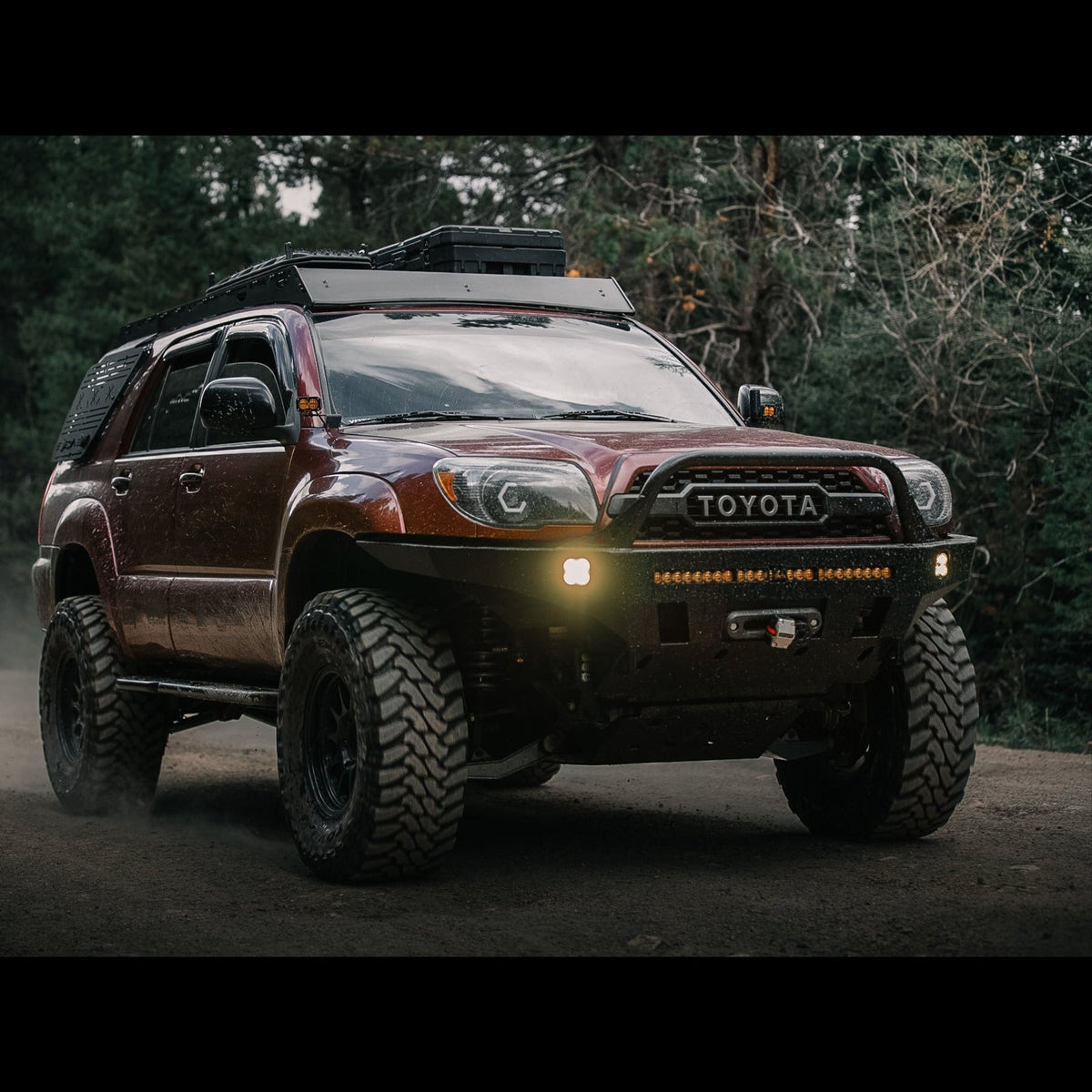 Action shot of a maroon 4Runner Overland Series Front Bumper 4th Gen 2003-2009