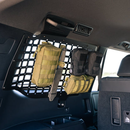 Molle bags and knife on the 2024 Toyota Land Cruiser Rear Window Molle Storage Panels