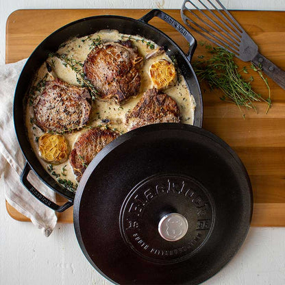 Freshly made pan-seared ribeye steak with garlic butter sauce, prepared and served in braiser.