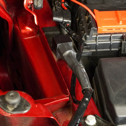 Close-up of a car battery and 40 Amp Wire Harness with DT Connector & Switch