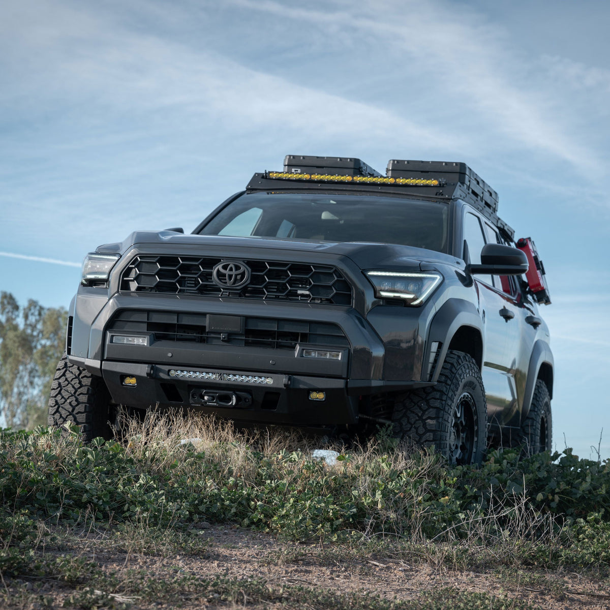 High Clearance Additions for the 6th Gen 4Runner Lo-Pro Bumper on a grassy hillside