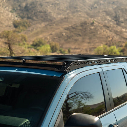 6th Gen Toyota 4Runner Roof Rack Light Cutout with a mountainous landscape in the background