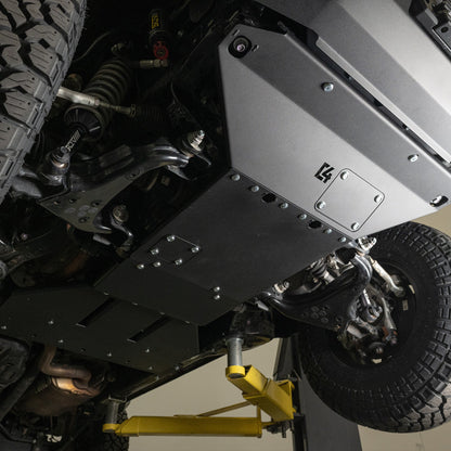 C4 Skid Plates for the 6th Gen 4Runner, taken on the lift. Rear skid is visible as well.