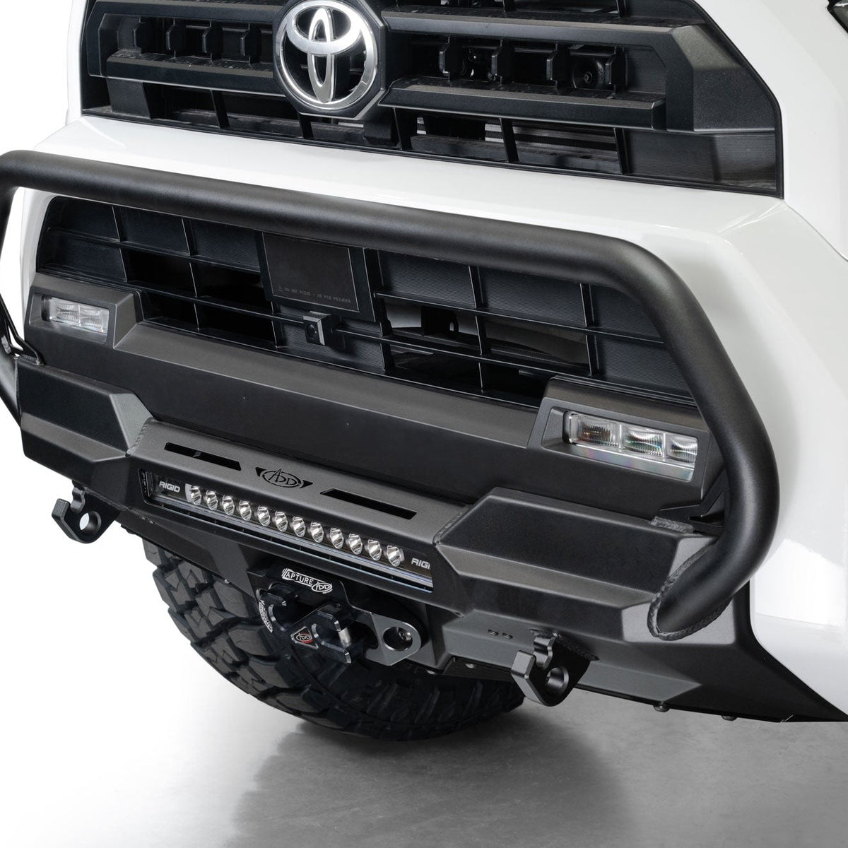 Close-up of a 2025 Toyota 4Runner Stealth Center Mount Front Bumper with Top Hoop on a white background