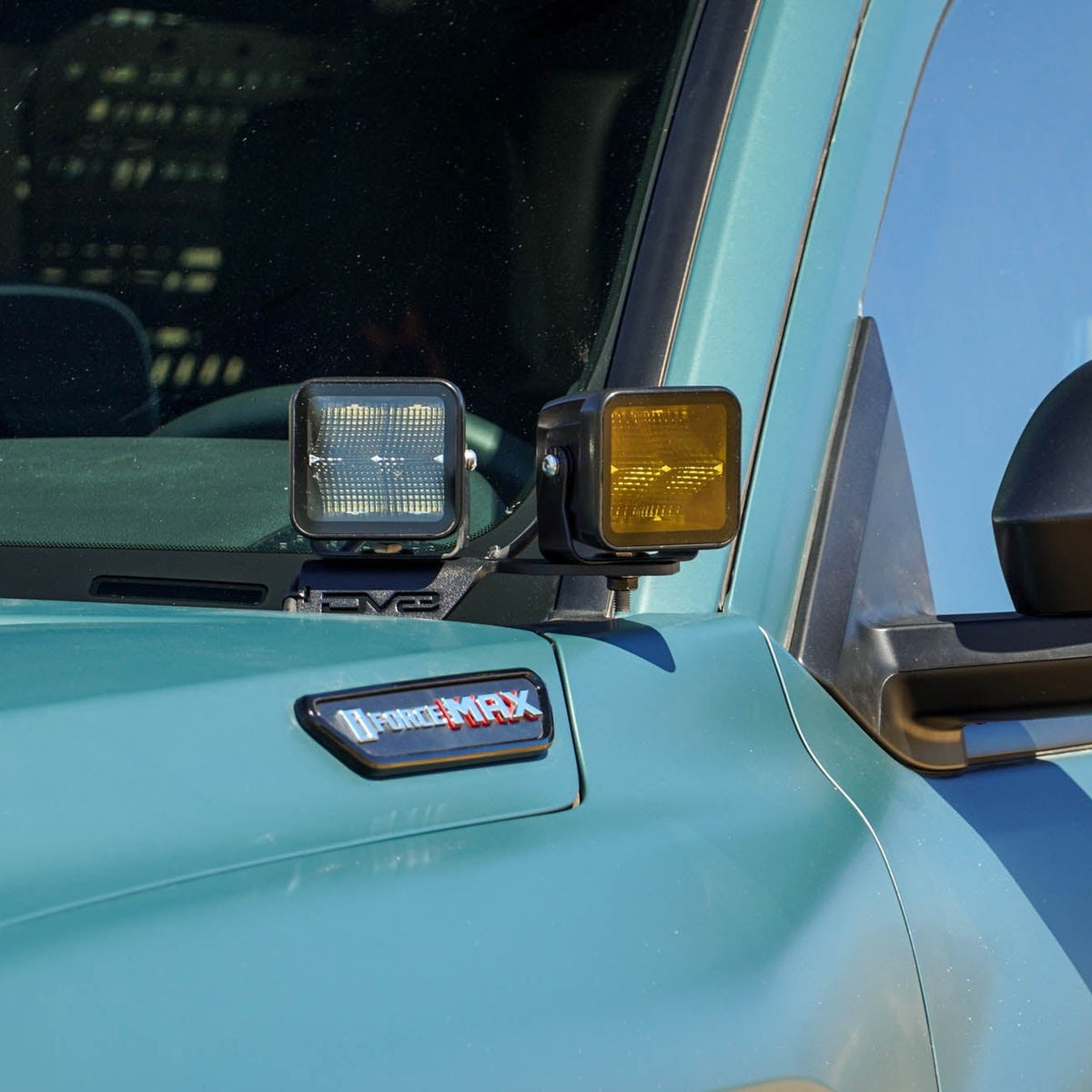 6th Gen Toyota 4Runner Ditch Light Brackets installed with clear and amber light pods.