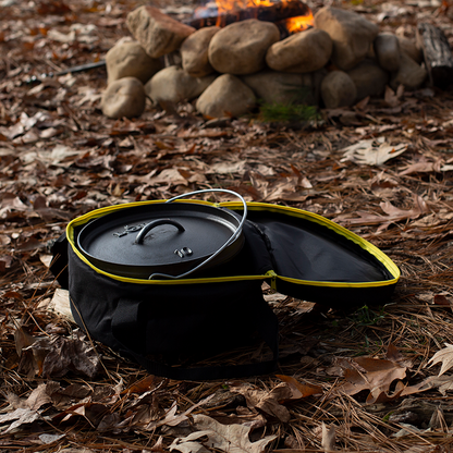 Camp dutch oven inside tote bag with top open at campsite.