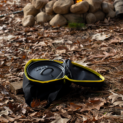 Camp dutch oven inside tote bag with top open at campsite.