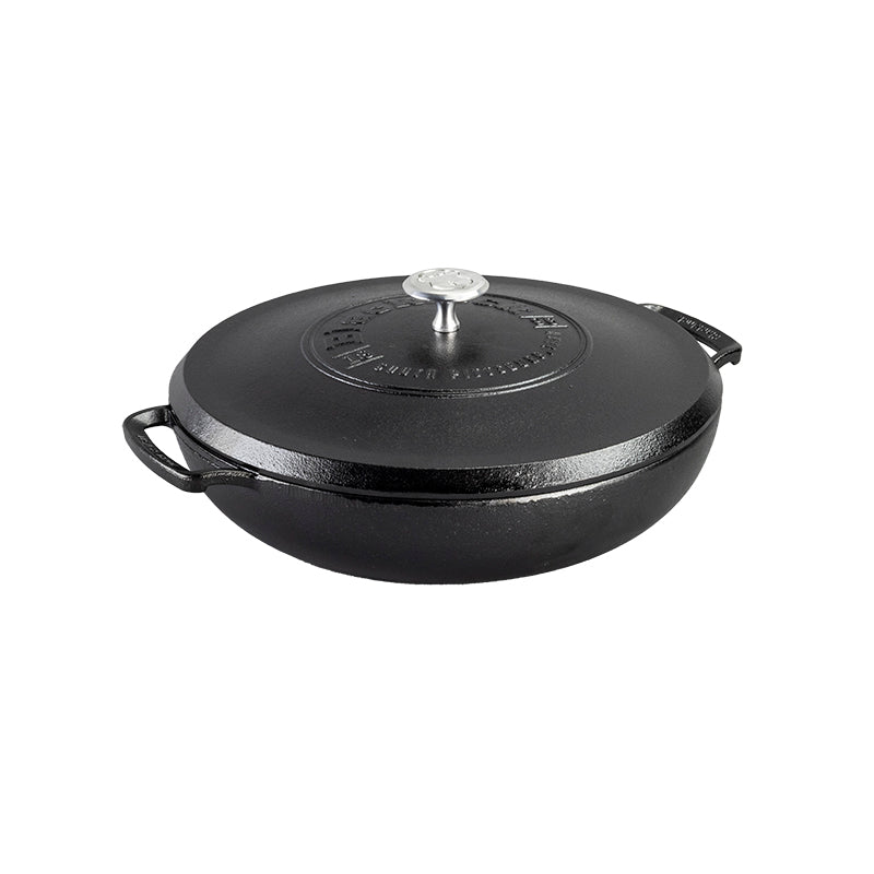 Circular pan with 2 handles and a lid.