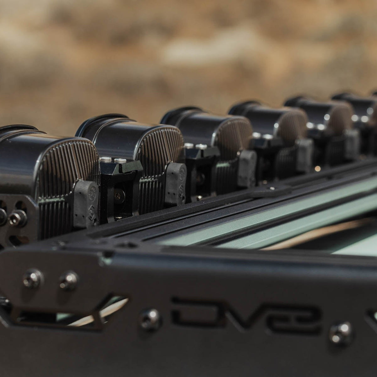 Rear-angle view of Baja Designs Linkable Lightbar Mount for DV8 Roof Rack Light Option installed on DV8 Toyota roof rack