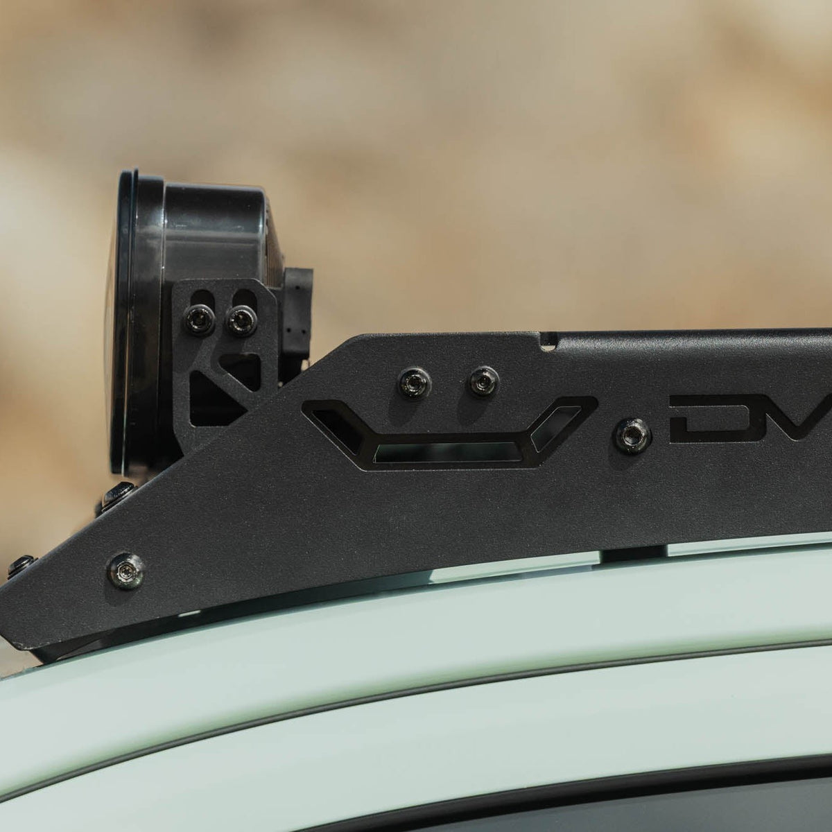 Side view of Baja Designs Linkable Lightbar Mount for DV8 Roof Rack Light Option installed with DV8 Toyota 4runner roof rack