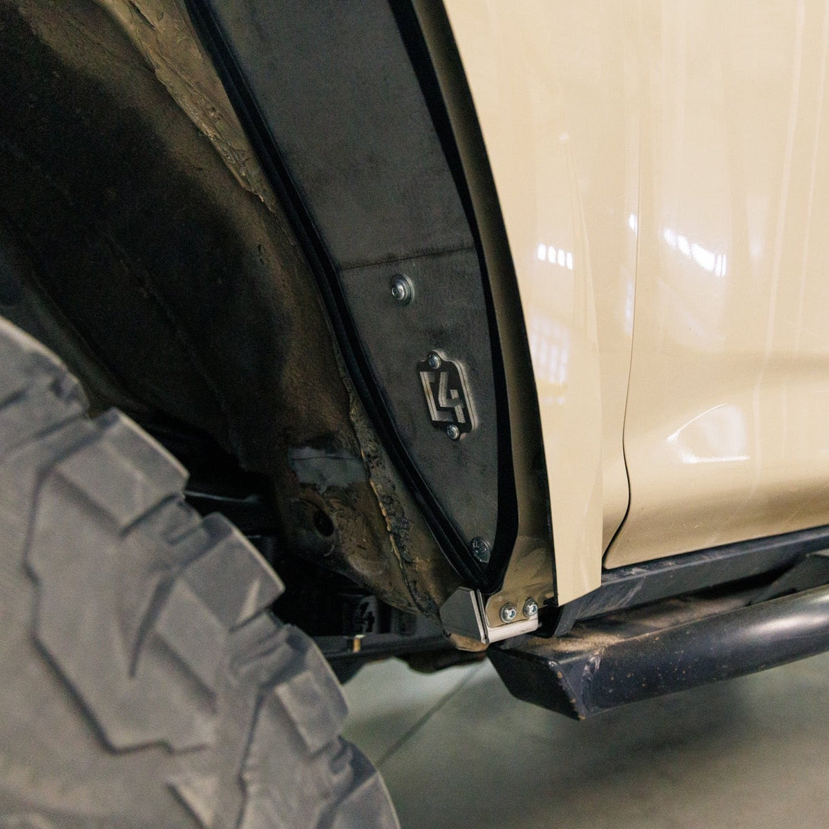 Close up view of the C4 high clearance fender liner at the back and bottom of the 5th Gen 4Runner's wheel well.