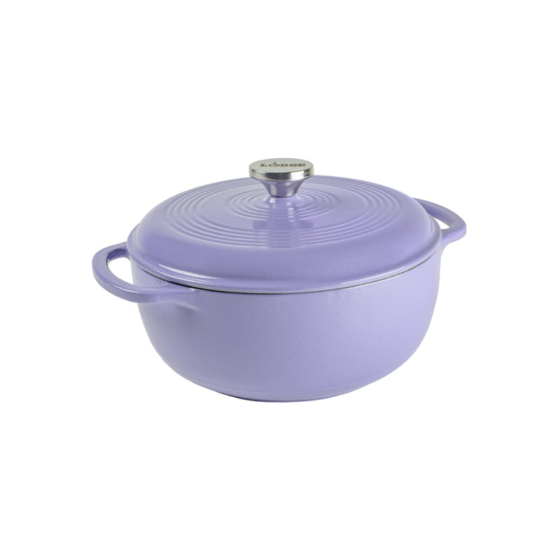 Lilac enameled cast iron Dutch oven with lid on a white background