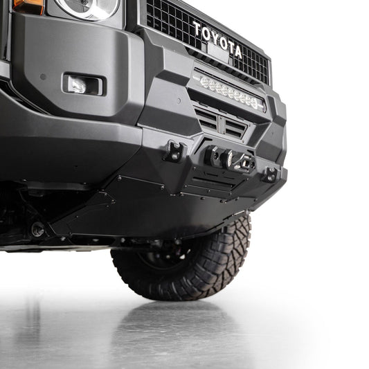 Low angle view of Toyota Land Cruiser Stealth Center Mount Winch Front Bumper for 2024 and newer vehicles installed with skid plate