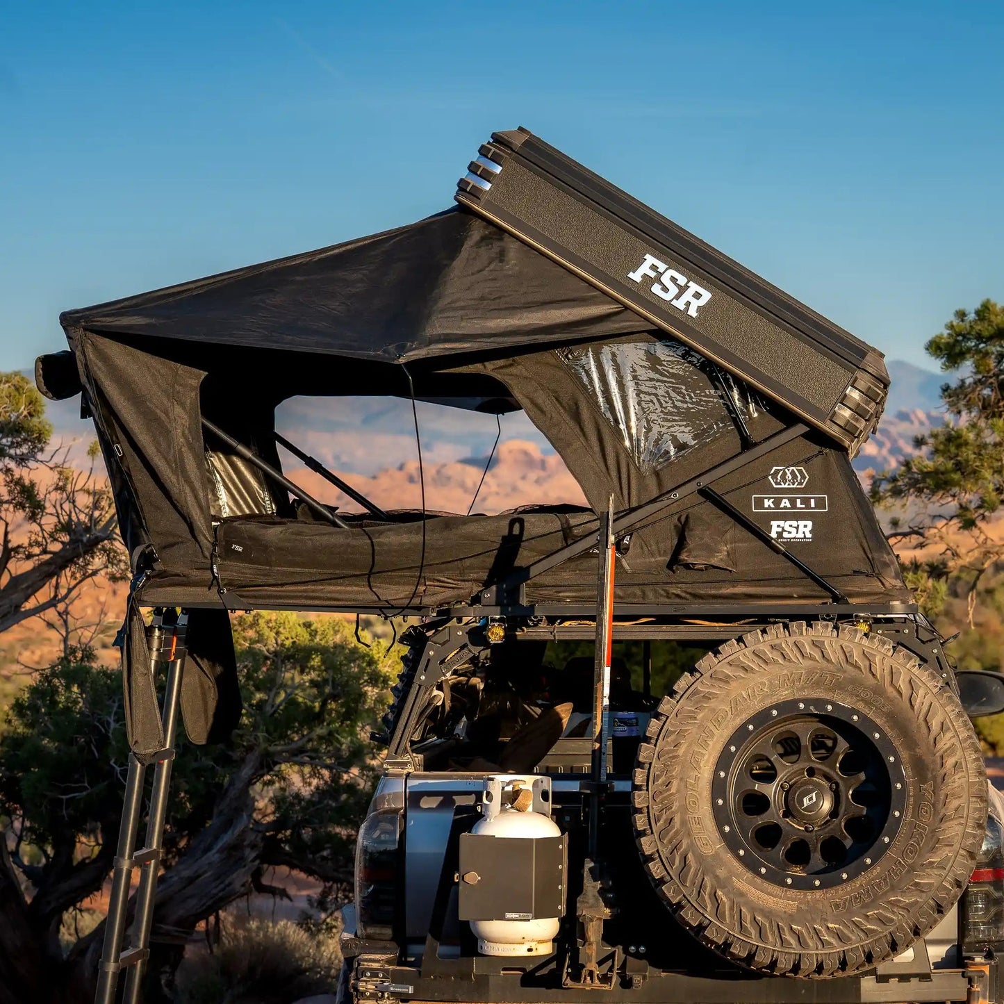 FSR Kali Roof Top Tent from Free Spirit Recreation installed on a Toyota Tacoma Beed Rack and setup in a desert campsite