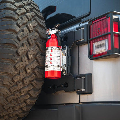 Red fire extinguisher attached to Jeep Wrangler JK Tailgate Reinforcement Molle Panel