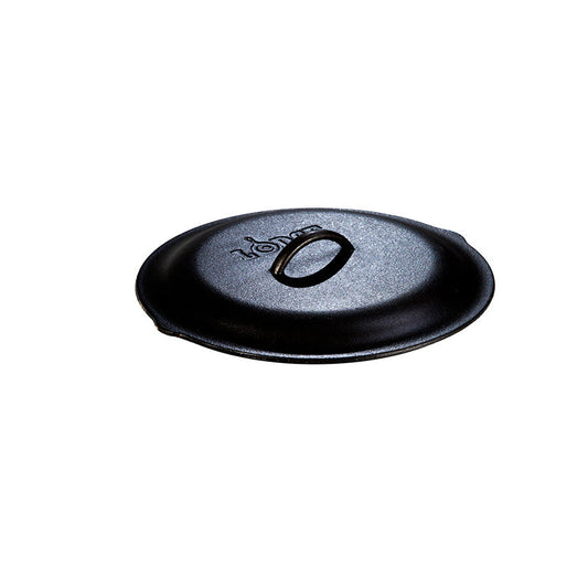 Seasoned cast iron lid with Lodge branding and handle in the middle.