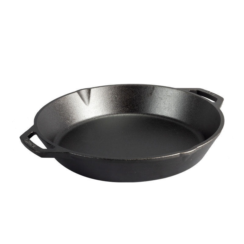 Black cast iron skillet with two loop handles and two pour spots.