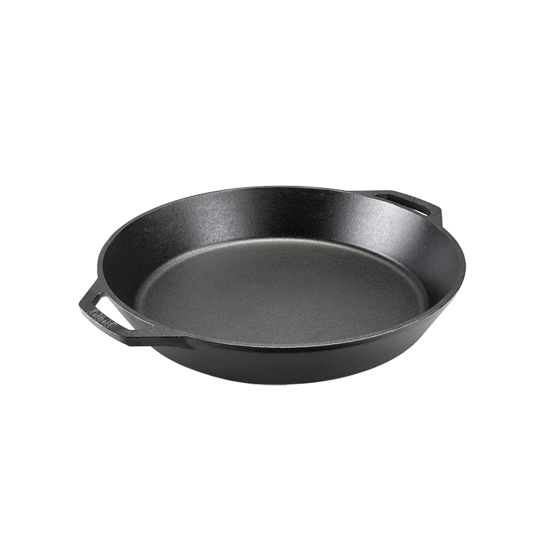 Black cast iron skillet with two loop handles.