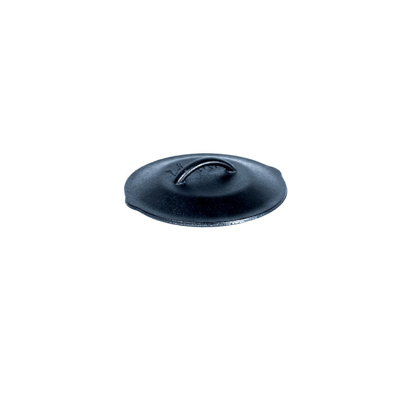 Seasoned cast iron lid with Lodge branding and handle in the middle.