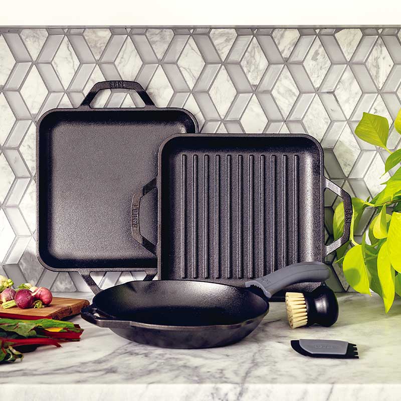 Cookware set displayed on kitchen counter.