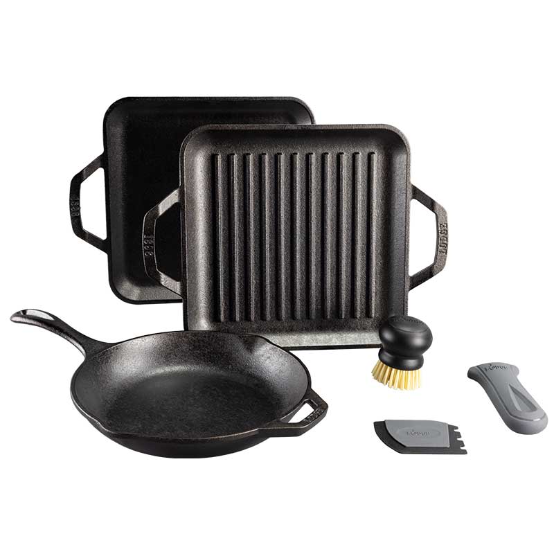 Set of cast iron cookware including a skillet, grill pan, griddle, brush, a grey silicone handle holder, and scraper on a white background.