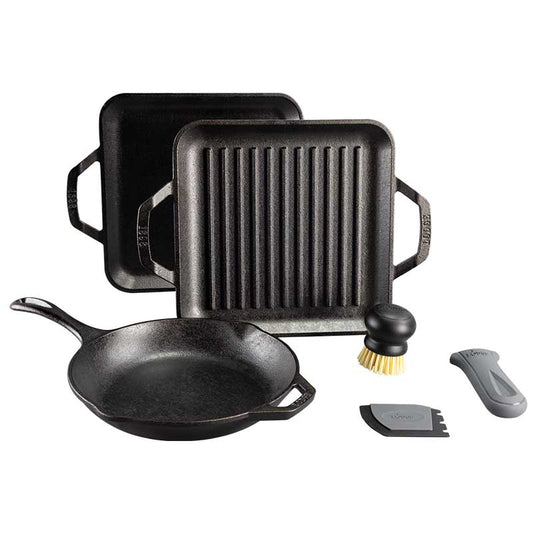 Set of cast iron cookware including a skillet, grill pan, griddle, brush, a grey silicone handle holder, and scraper on a white background.