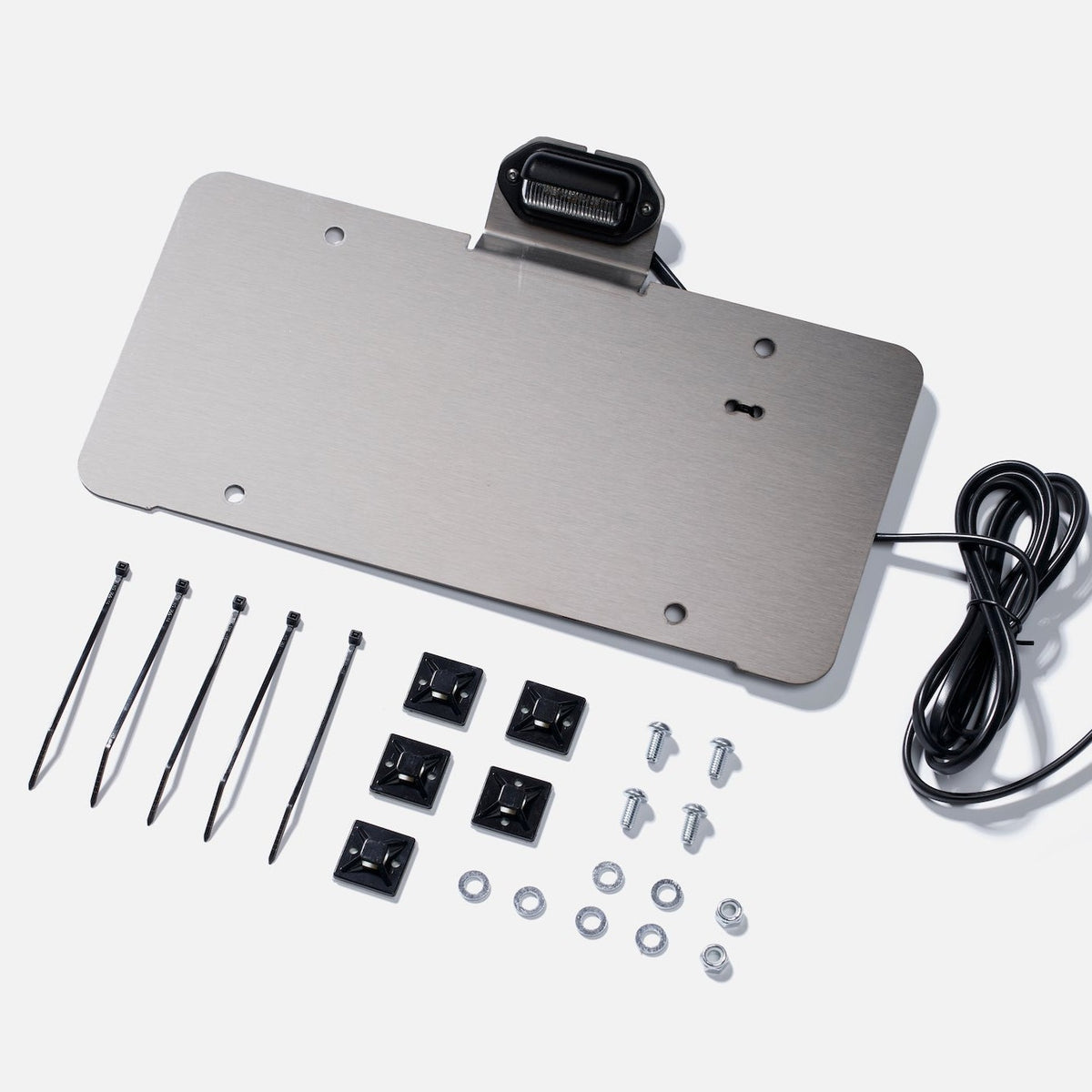 License Plate Light Kit hardware and mounting accessories laid out on a white background