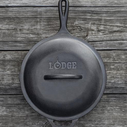 Top view of lid on skillet, displaying branding and handle.
