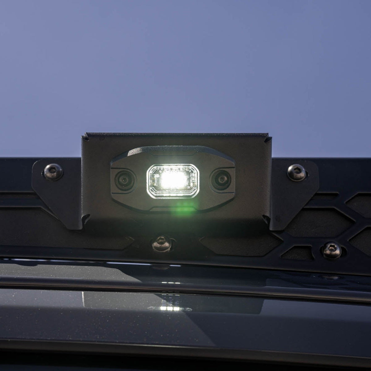 DV8 Micro Elite Utility Light mounted on a roof rack