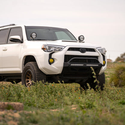 5th Gen Toyota 4Runner Ditch Light Brackets, installed on 4 runner parked in grassy field