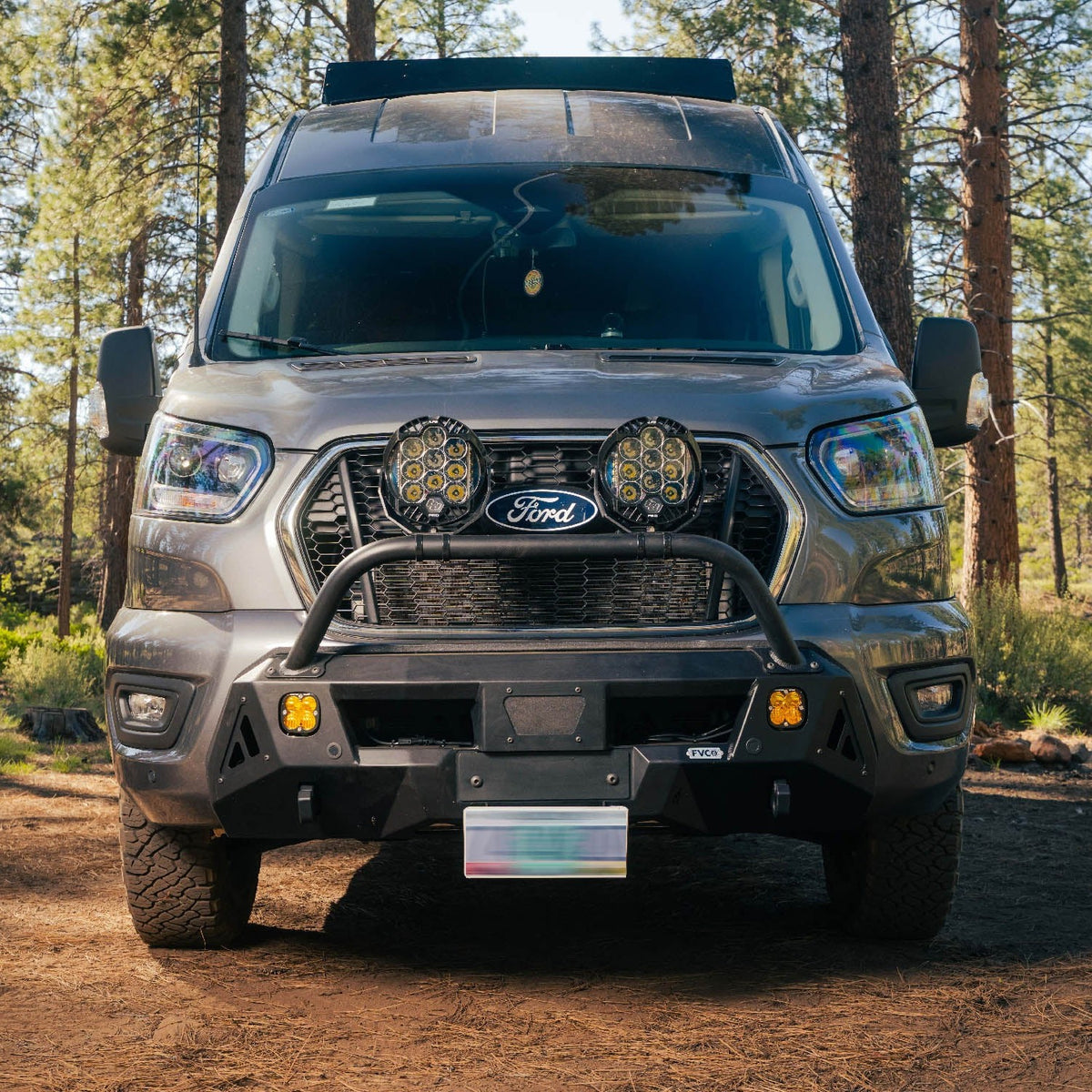 Ford Transit van with Transit Core Front Bumper parked at camp