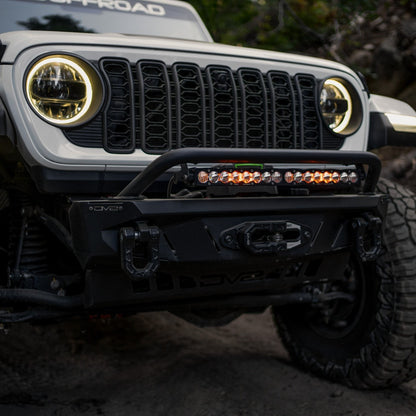 Front view of Jeep driving the trails with Spec Series bumper and the Universal Spec Series Bull Bar installed