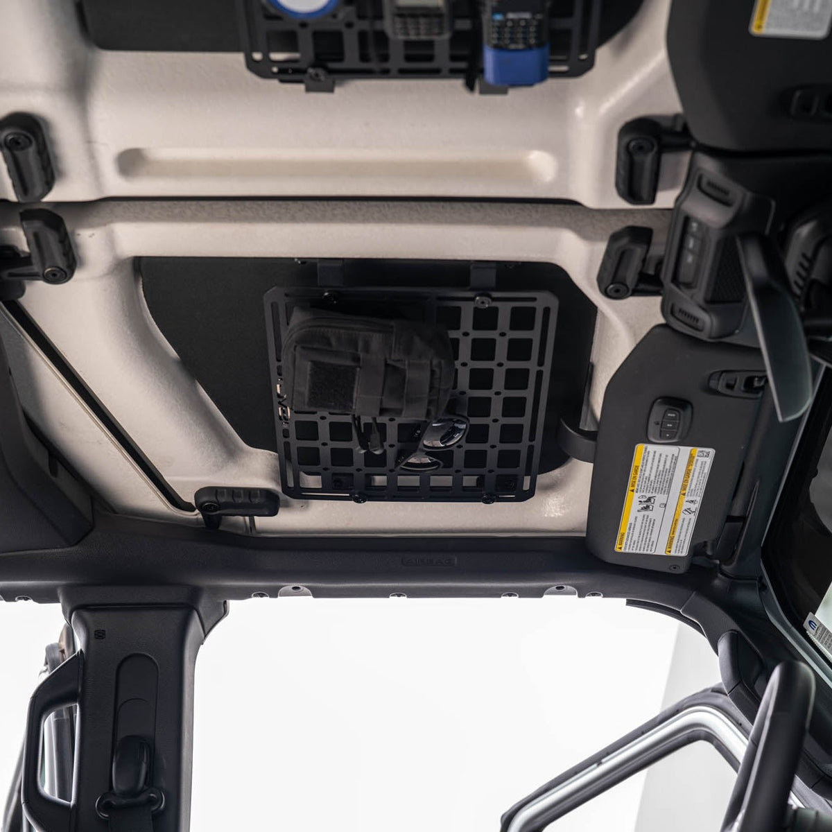 Jeep Wrangler JL Roof Mounts with 15” x 12” Molle Panel installed with bag and glasses mounted