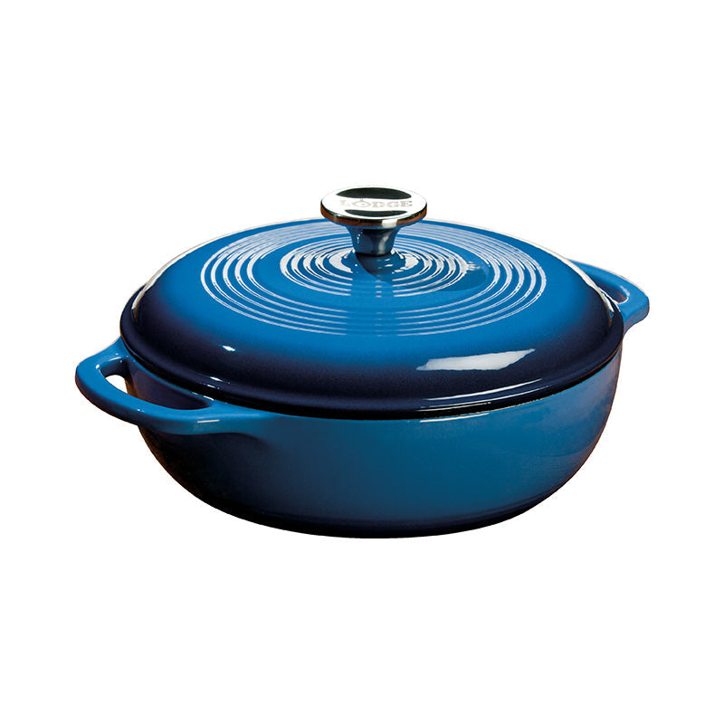 Blue gradient enameled cast iron Dutch oven with lid, both pieces have light blue on top and darken towards the bottom.