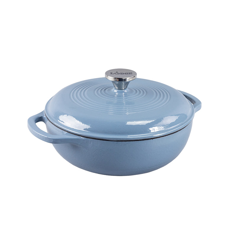 Storm blue enameled cast iron Dutch oven with lid on a white background