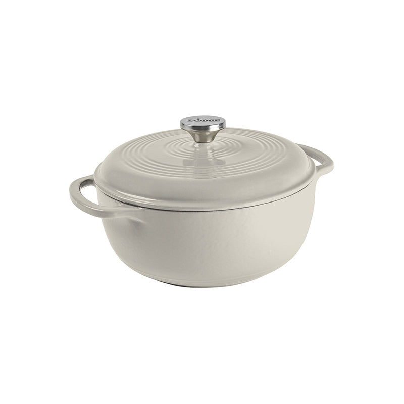 Oyster white enameled cast iron Dutch oven with lid on a white background