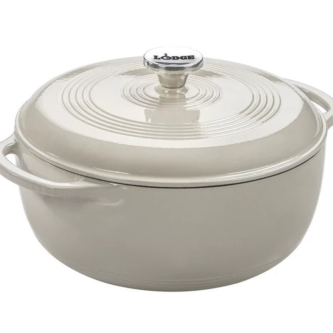 Oyster white enameled cast iron Dutch oven with lid on a white background