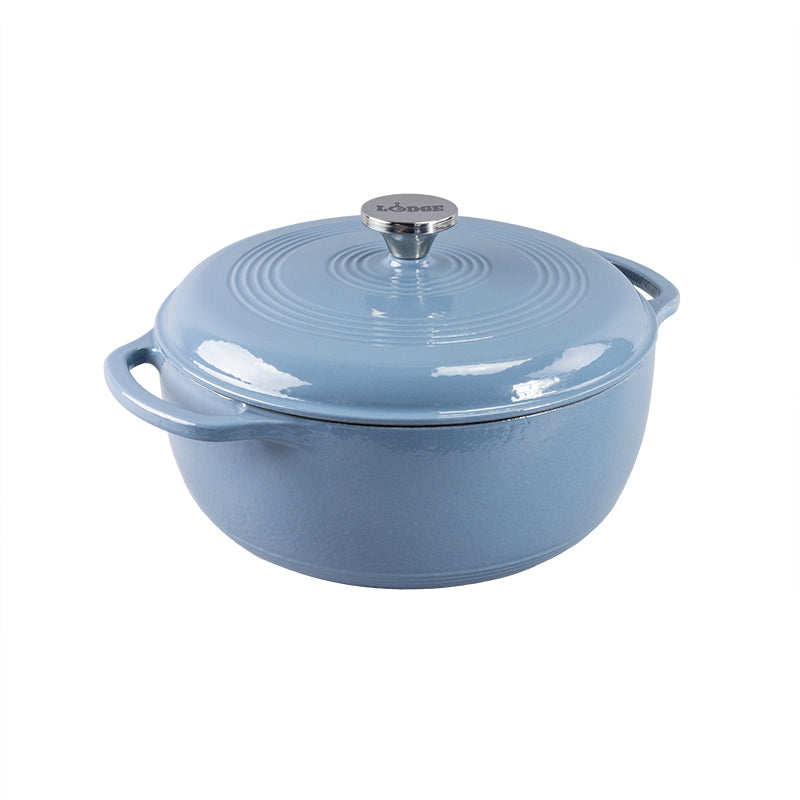 Storm blue enameled cast iron Dutch oven with lid on a white background