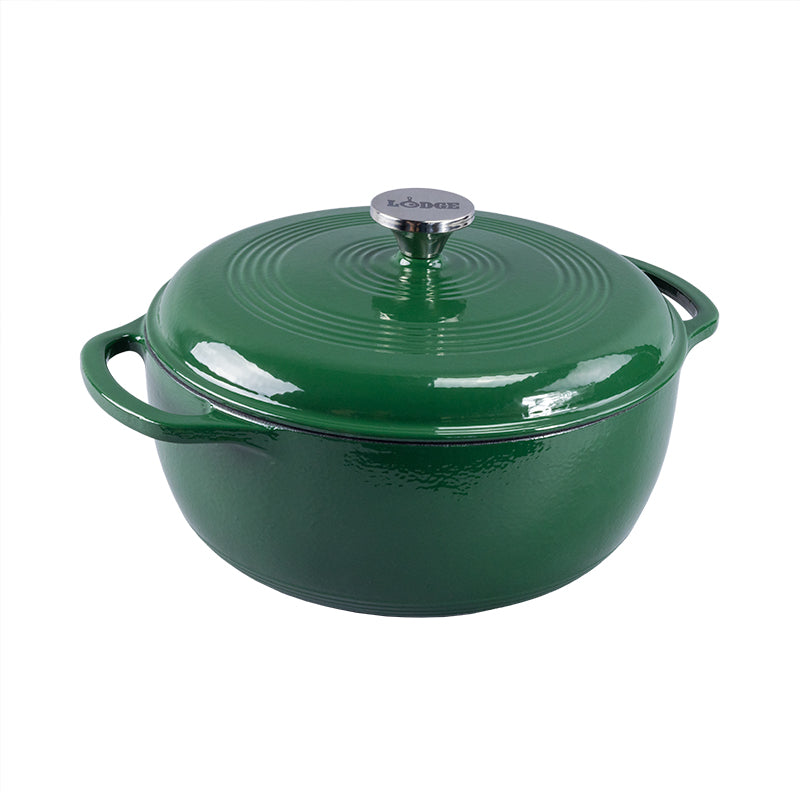 Evergreen enameled cast iron Dutch oven with lid on a white background