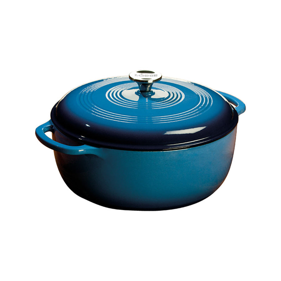 Blue gradient enameled cast iron Dutch oven with lid, both pieces have light blue on top and darken towards the bottom.