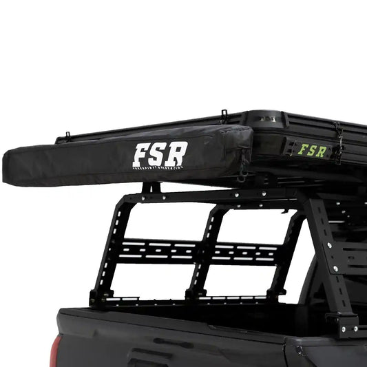 FSR 180 tailgate awning closed up in the zippered storage bag, mounted to a Free Spirit Recreation rooftop tent on the rear of a 4x4 Toyota Tacoma