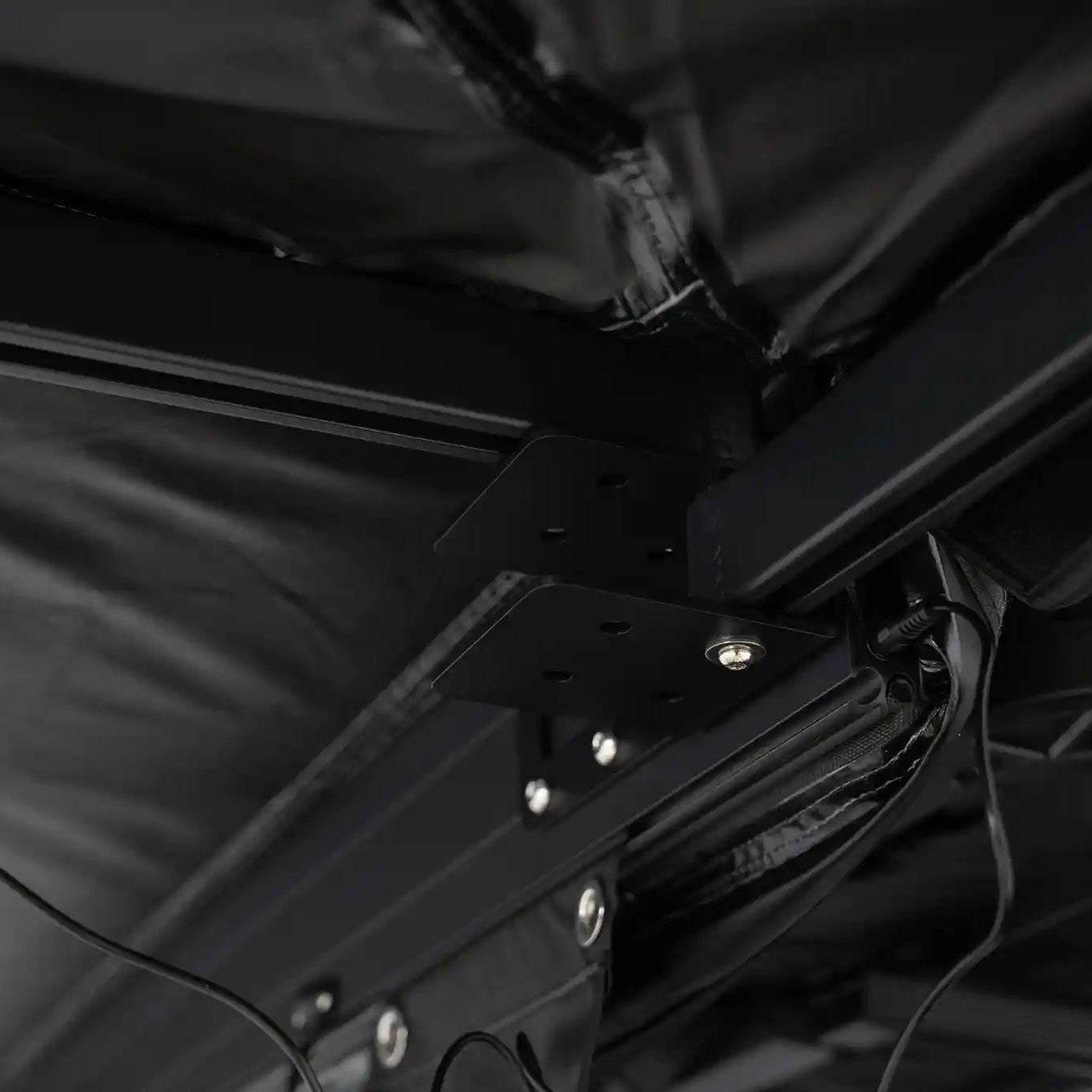 Close-up of the heavy-duty hinge used on the free standing FSR 180 tailgate awning, with built-in LED light wiring visible