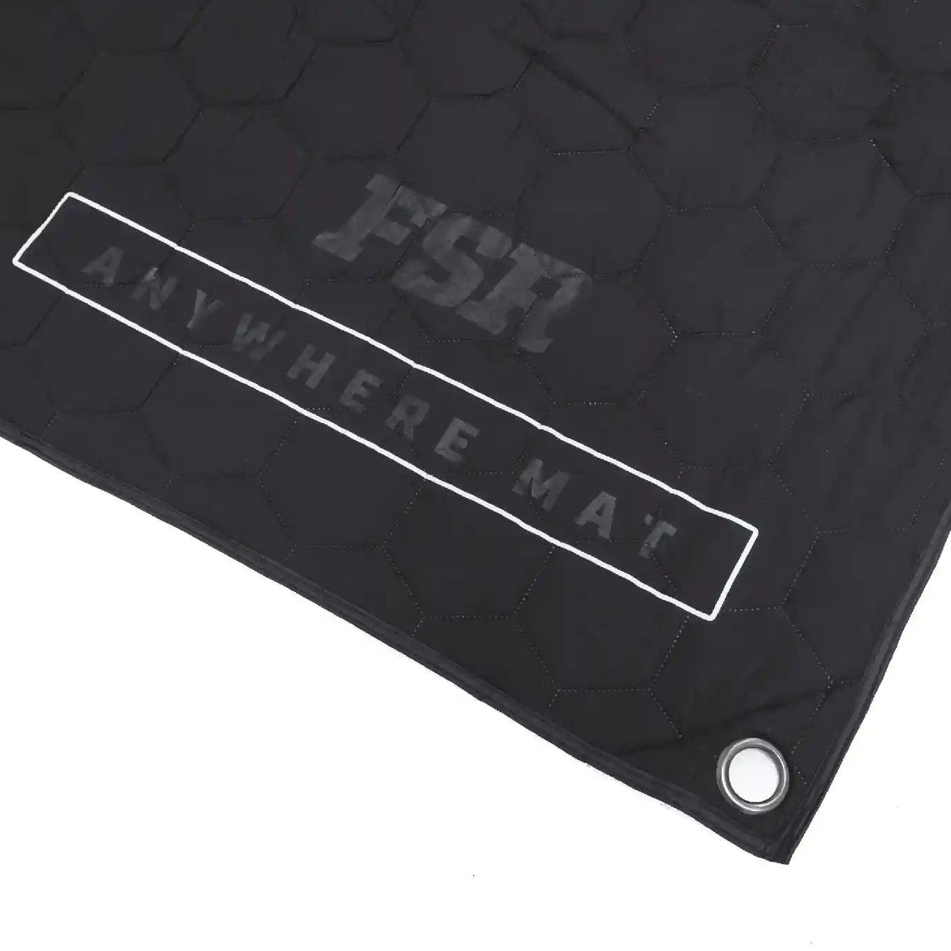 Close up of the FSR Anywhere Camping Mat branding and reinforced corner grommet on a white background